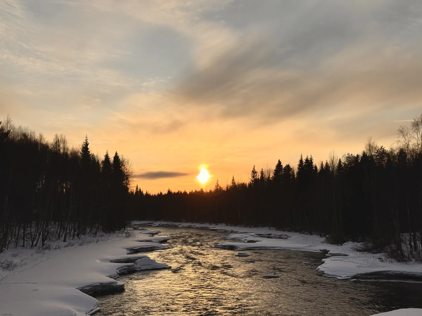 Taiga forest river at golden hour, Rovaniemi Lapland